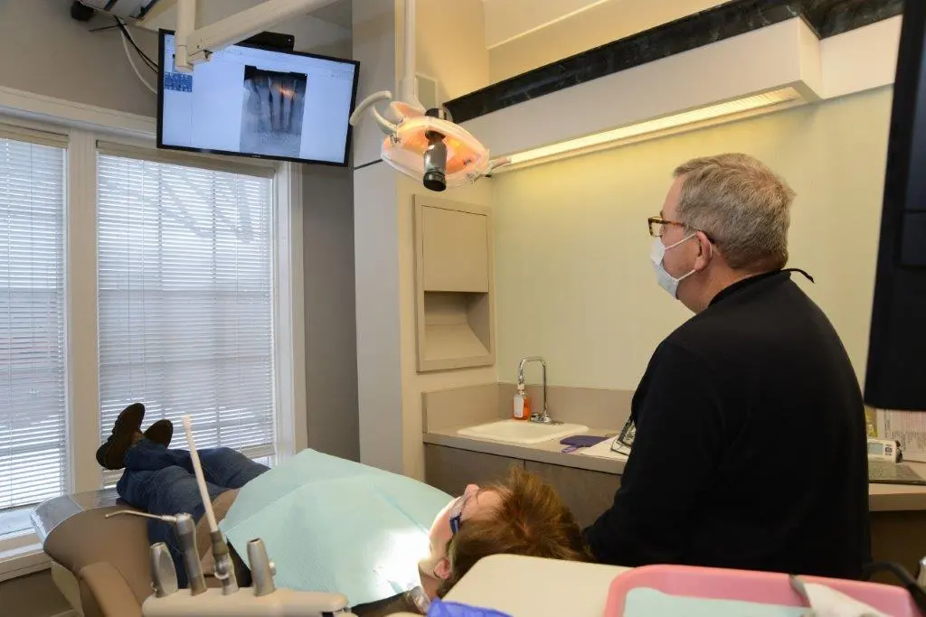 Dr. Gardner and patient in exam room