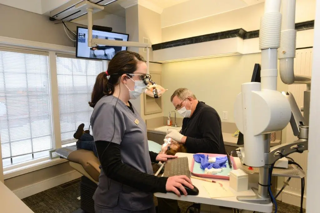 Photo of staff and doctor working on patient