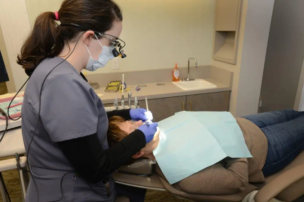Photo of staff working on patient