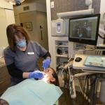 Photo of staff working on patient  from a distance