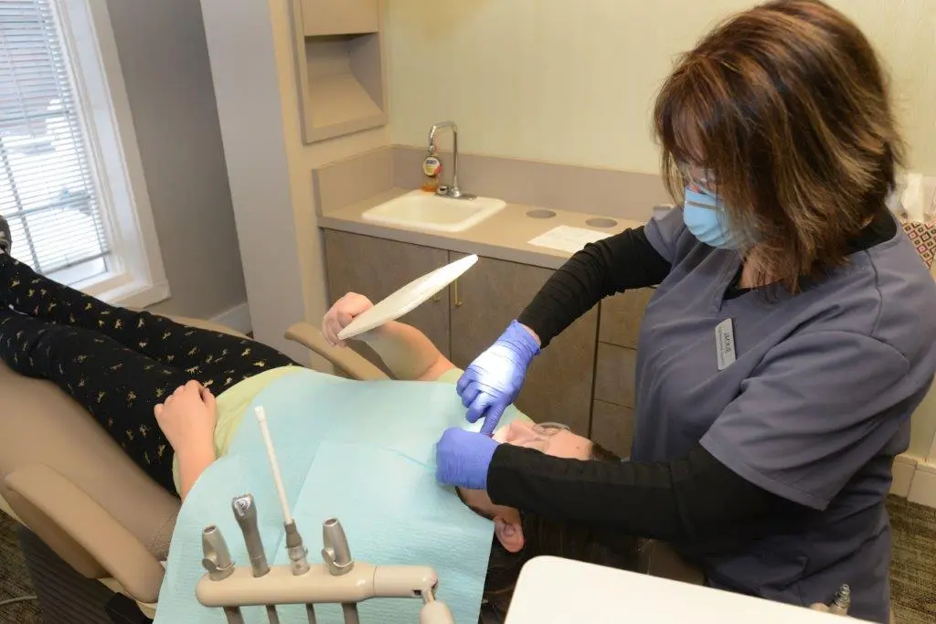 Photo of staff working on patient close up image