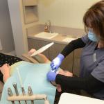 Photo of staff working on patient close up image